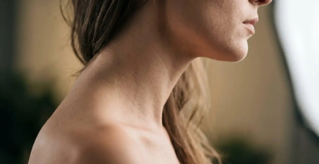 Natural posture demonstration showing relaxed shoulders and extended neck position for flattering candid photography